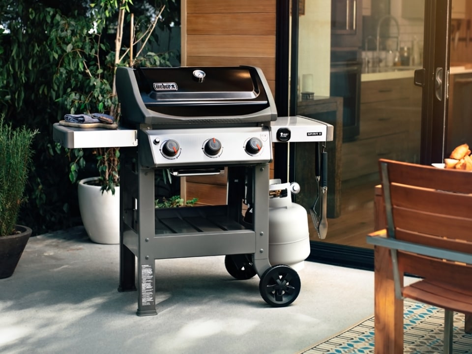 Outdoor grill station setup with grilling tools and design elements